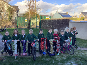 pupils on their tinsel decorated bikes and scooters.