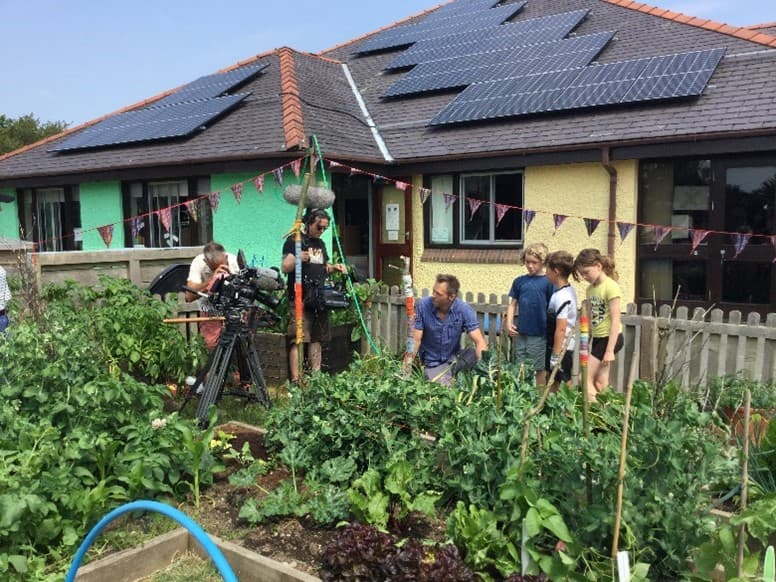 Film crew filming the garden