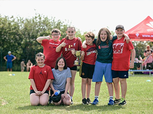 Children in sports wear smiling during sports day